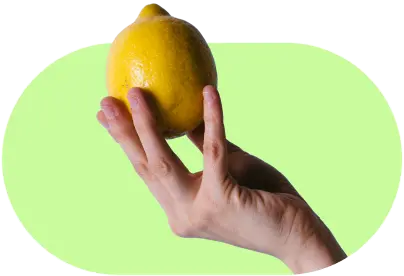 Hand holding a lemon